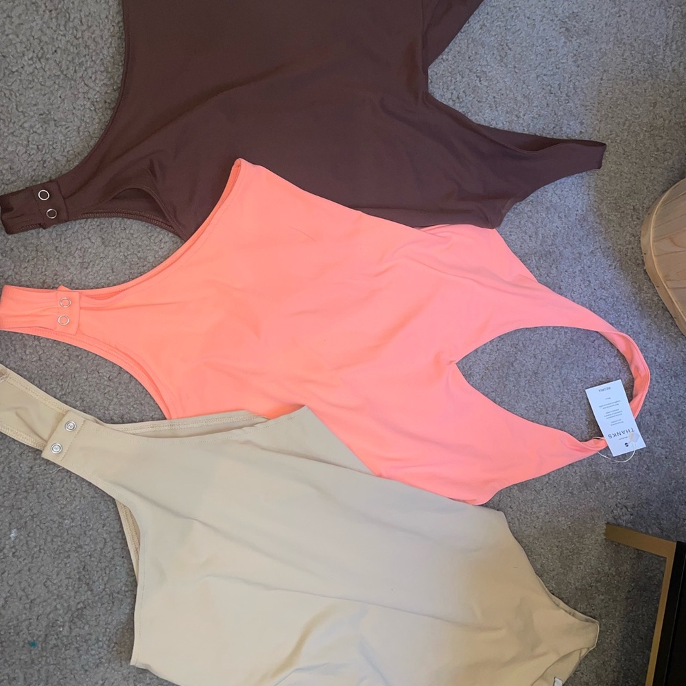 Set of Three One-Shoulder Bodysuits in Brown, Peach, and Beige